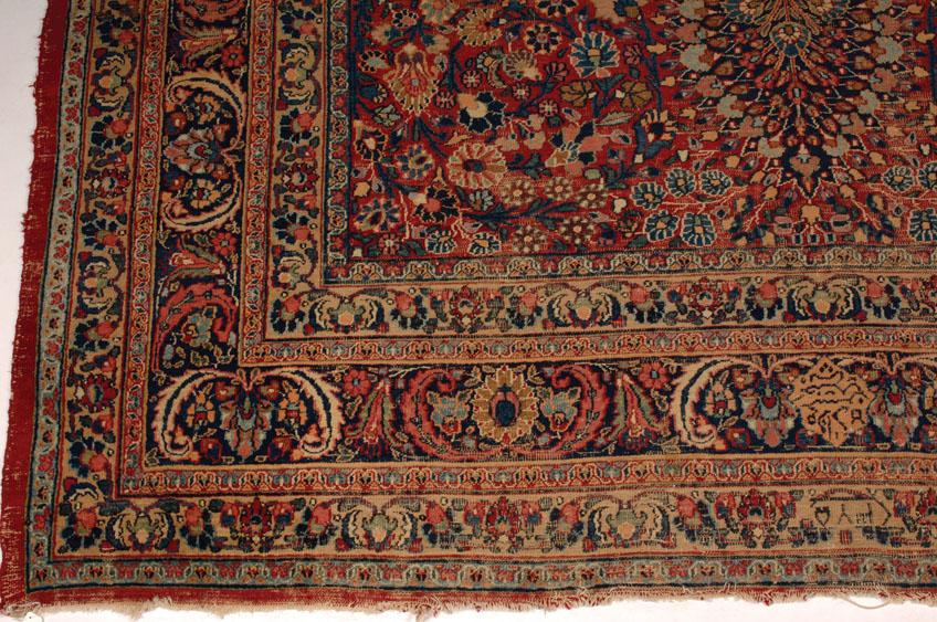 Appraisal: A TABRIZ TYPE SMALL CARPET the brick red ground worked