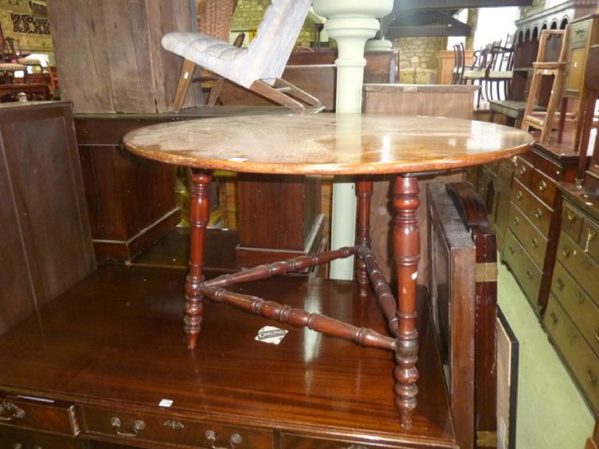 Appraisal: A Victorian mahogany cricket type table the circular top cm