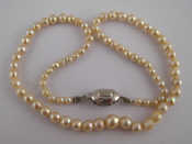 Appraisal: A cultured pearl necklace approx cm long pearls approx mm