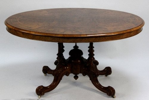 Appraisal: A Victorian walnut loo table the oval top with boxwood