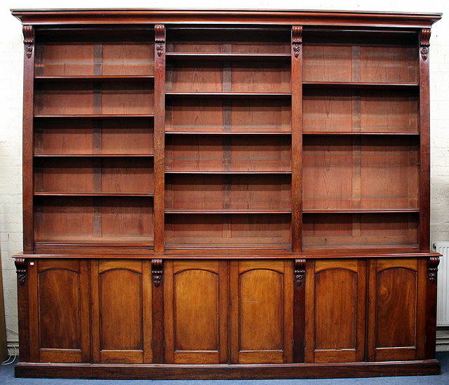 Appraisal: A LARGE VICTORIAN MAHOGANY LIBRARY BOOKCASE the upper section with