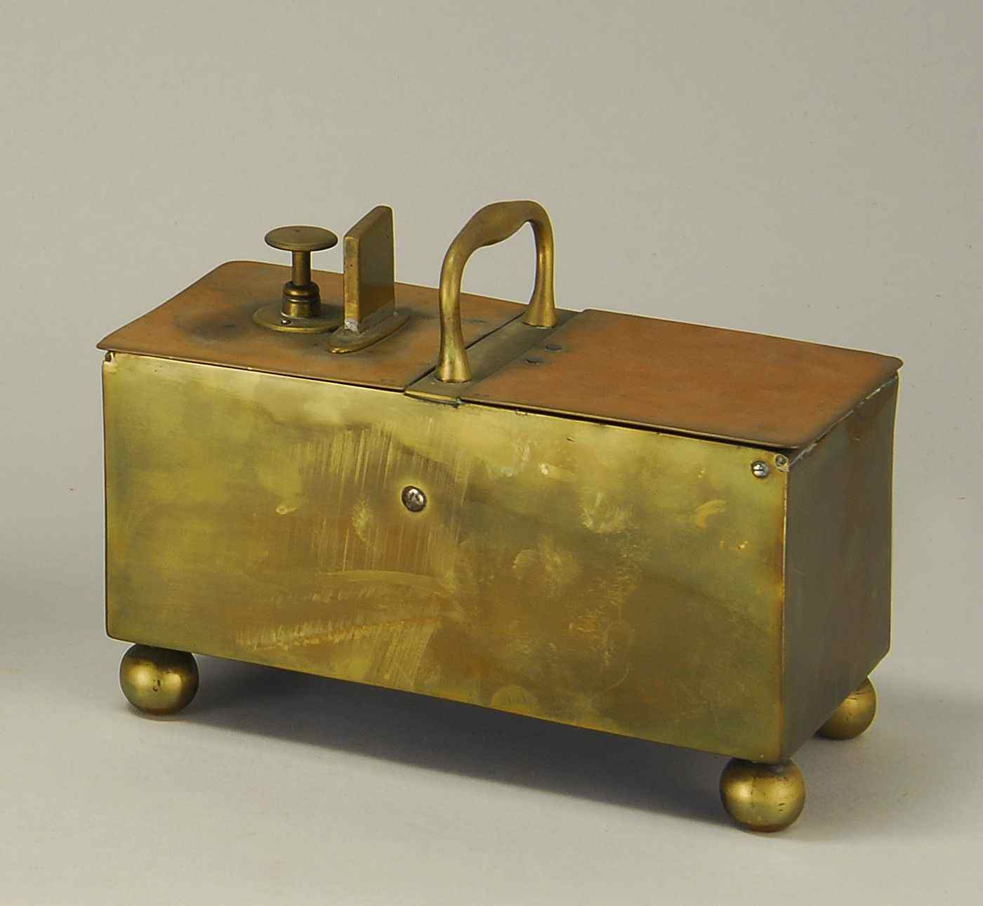 Appraisal: ANTIQUE ENGLISH BRASS MECHANICAL TOBACCO BOXEarly th CenturyOriginally used in