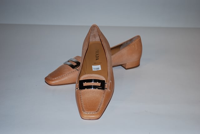 Appraisal: Prada tan leather loafers with toe buckle Size B Good