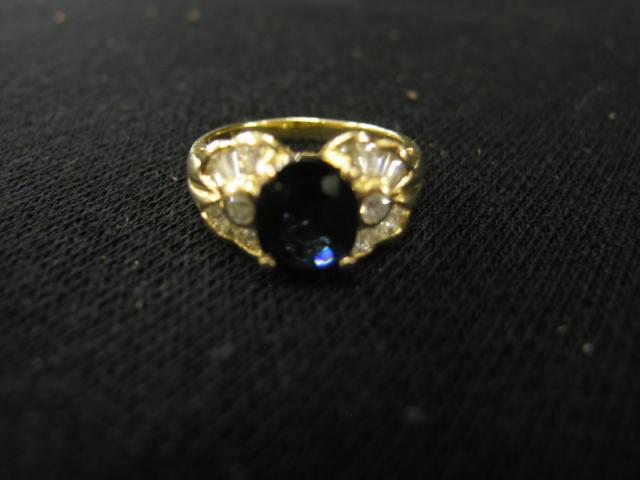 Appraisal: Sapphire Diamond Ring deep blue carat oval gem surrounded by