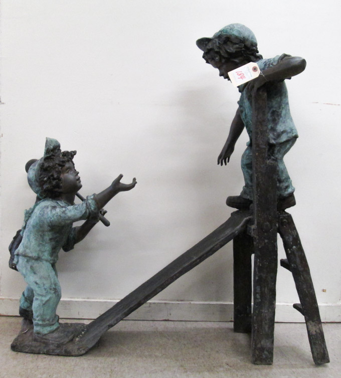 Appraisal: FIGURAL BRONZE GARDEN SCULPTURE two young boy golfers one at