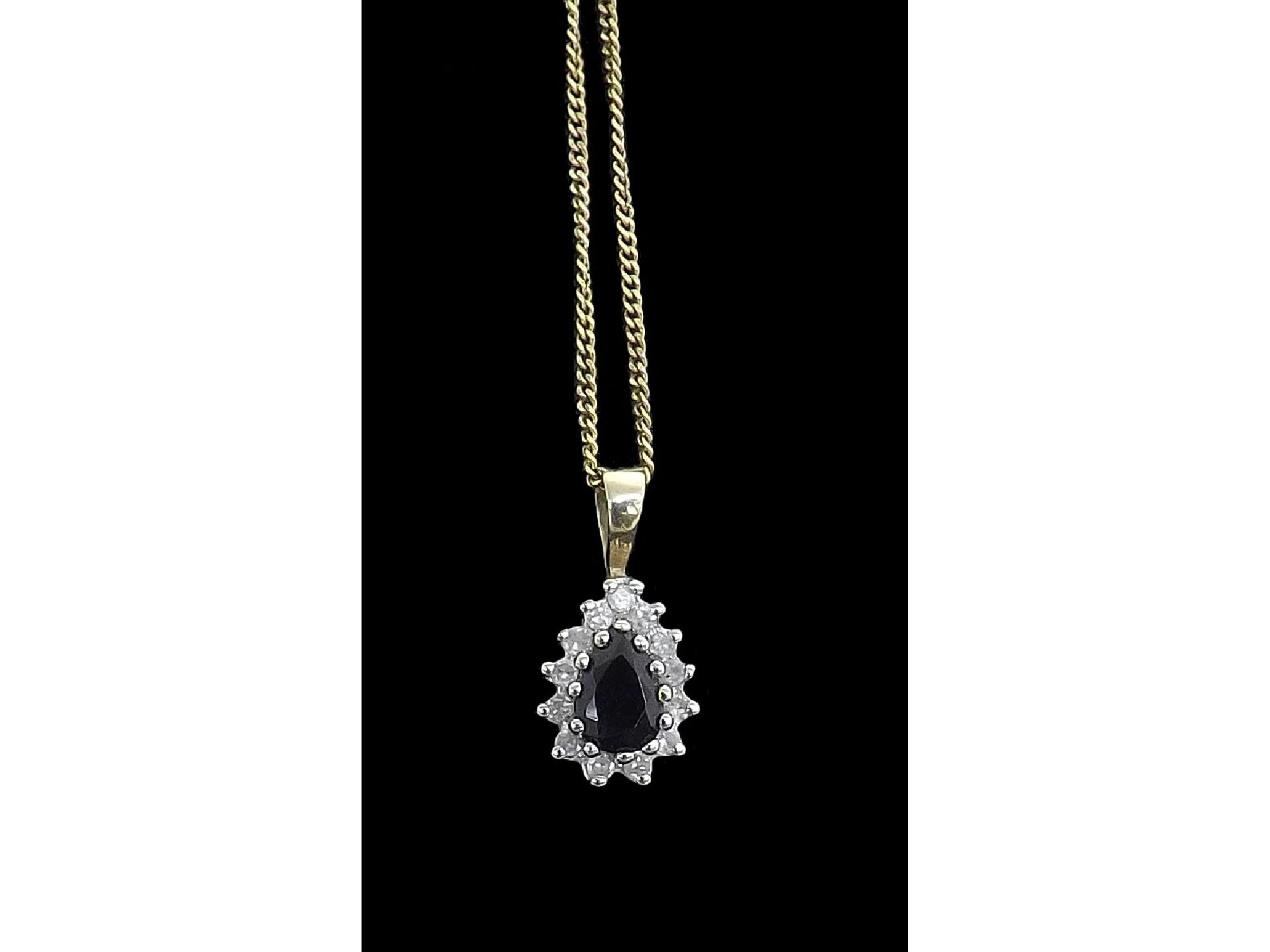 Appraisal: Diamond and sapphire set pendant on a ct necklet gm