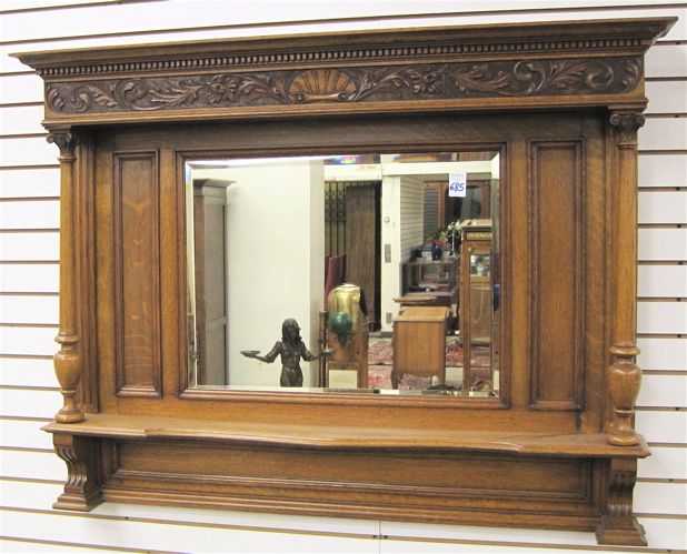 Appraisal: AN OAK OVER MANTEL MIRROR English c centering a rectangular