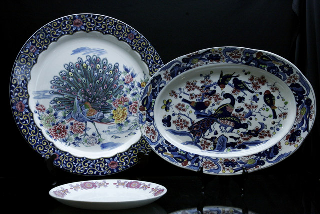 Appraisal: Two decorative serving dishes with peacock motif together with a