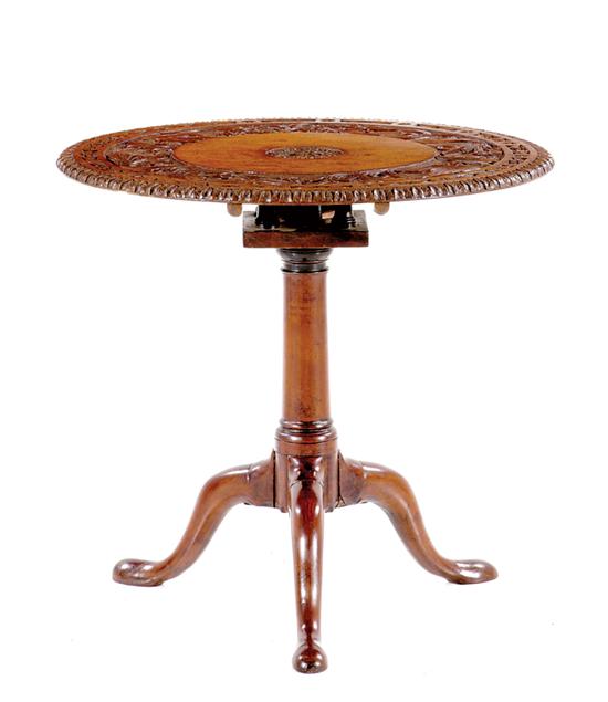 Appraisal: English carved mahogany tilt-top tea table th century circular top