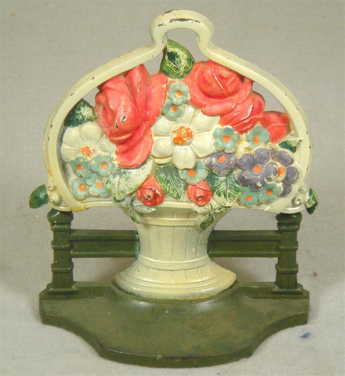 Appraisal: Cast iron doorstop small flower basket bookend on pedestal base