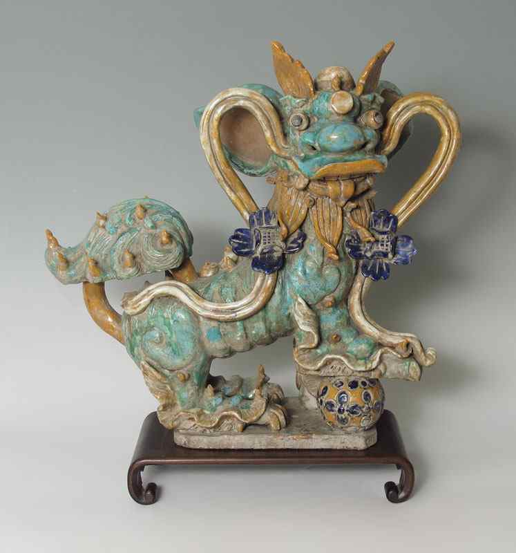 Appraisal: CHINESE POLYCHROME EARTHENWARE FOO DOG Polychrome glaze '' h x