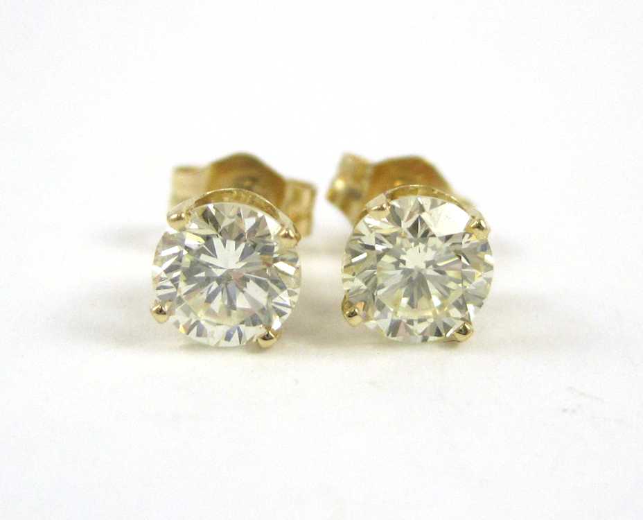 Appraisal: PAIR OF DIAMOND AND YELLOW GOLD EAR STUDS each k