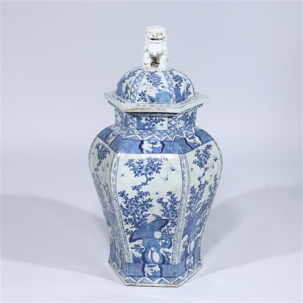 Appraisal: Large Chinese blue and white covered faceted vase with lion