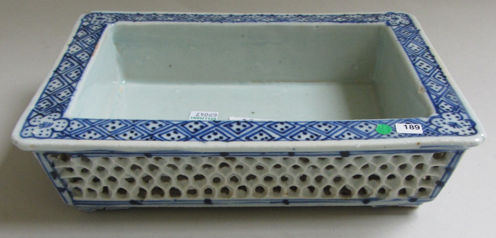 Appraisal: A Chinese porcelain blue and white reticulated crocus bowl circa