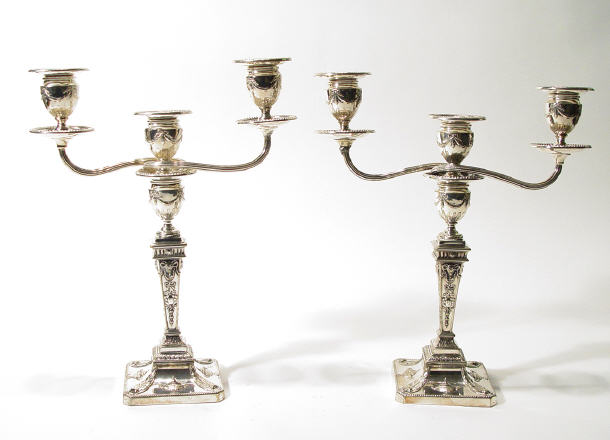 Appraisal: Pair of Edwardian three branch silver plated candelabra moulded with