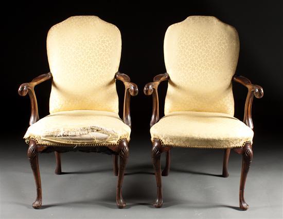 Appraisal: Pair of Queen Anne style carved mahogany upholstered armchairs late