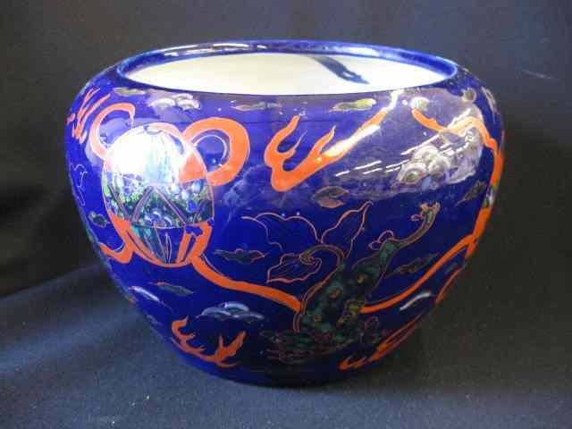 Appraisal: Chinese Pottery Jardinere dragons onrich blue field - '' diameter