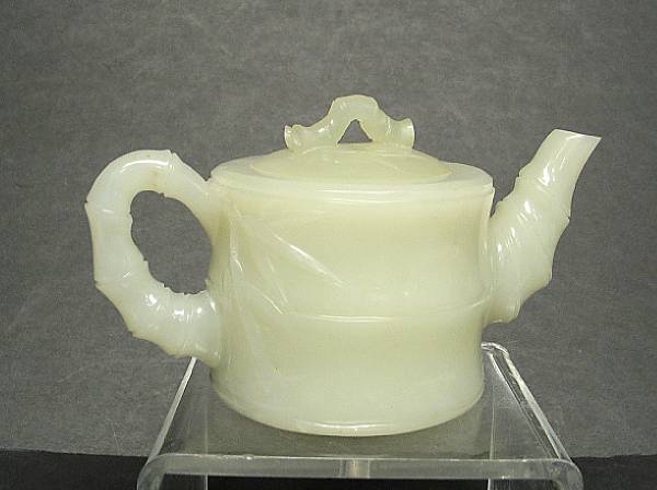 Appraisal: A pale greenish white jade tea pot Of cylindrical form