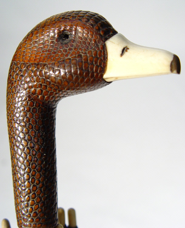 Appraisal: Art Deco umbrella with lizards-skin and ivory gooses head handle