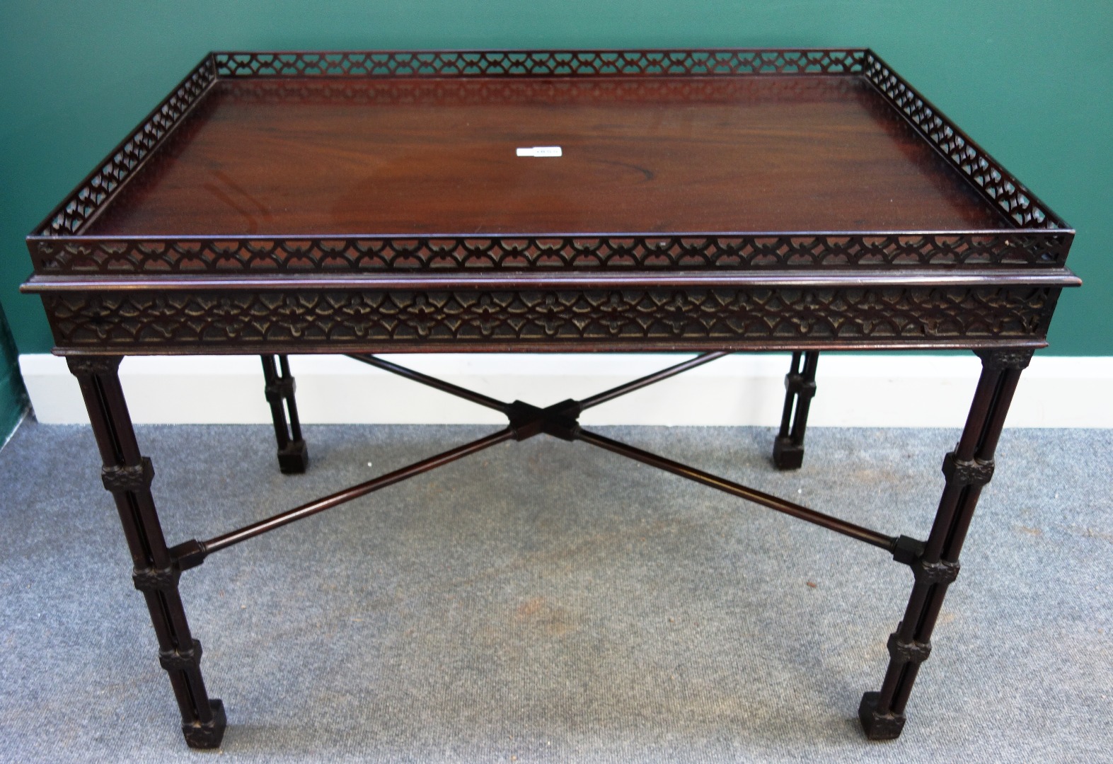 Appraisal: An th century rectangular mahogany silver table with pierced fret