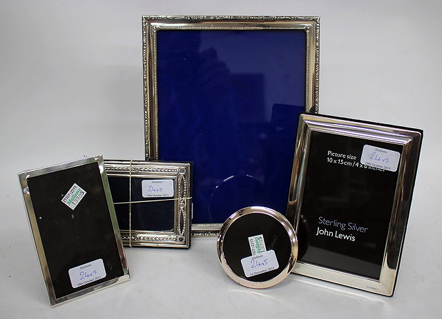 Appraisal: A SILVER MOUNTED PHOTO FRAME cm x cm together with