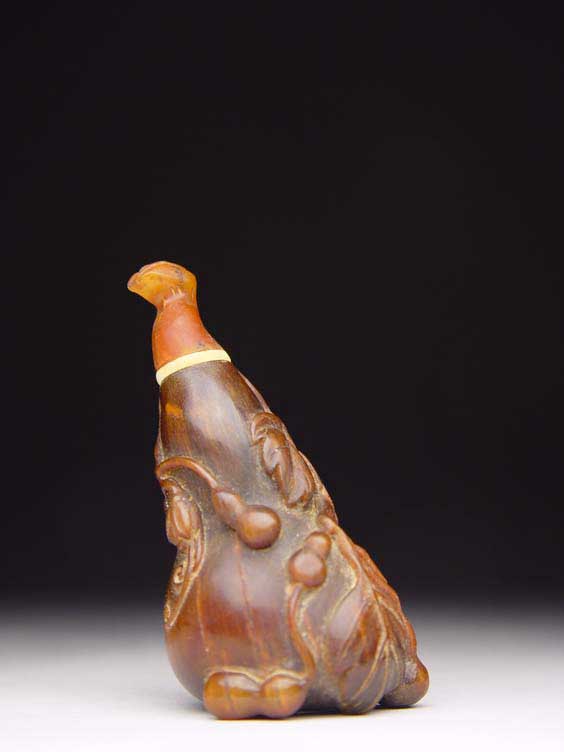 Appraisal: CARVED RHINO HORN SNUFF BOTTLE Finely carved rhinoceros horn snuff