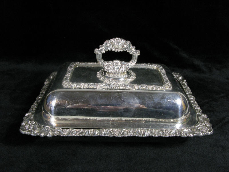 Appraisal: Ornate Silverplate Lidded Entr e Dish English silver on copper