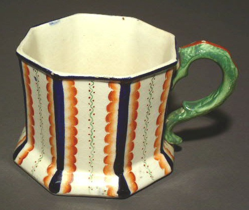 Appraisal: English Staffordshire frog mug with colorful vertical stripes h handle