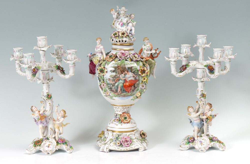 Appraisal: CAPODIMONTE CANDELABRA AND URN Cherubic figures and flower decorated Seven