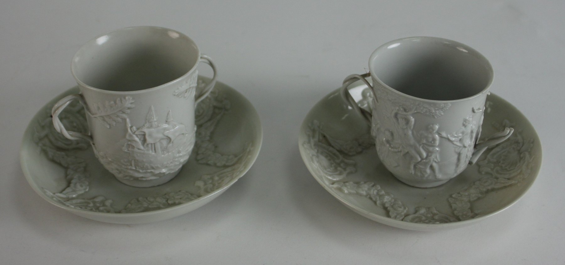 Appraisal: A pair of late th Century Doccia white-glazed chocolate cups