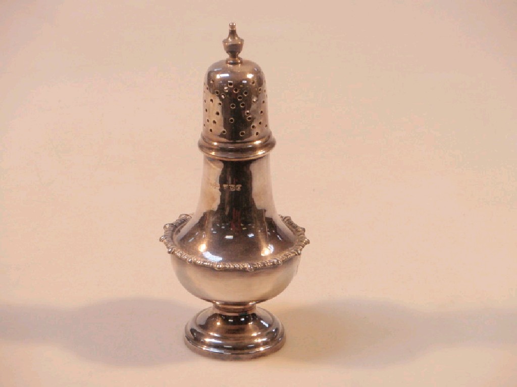 Appraisal: A silver sugar caster with gadroon border Sheffield oz