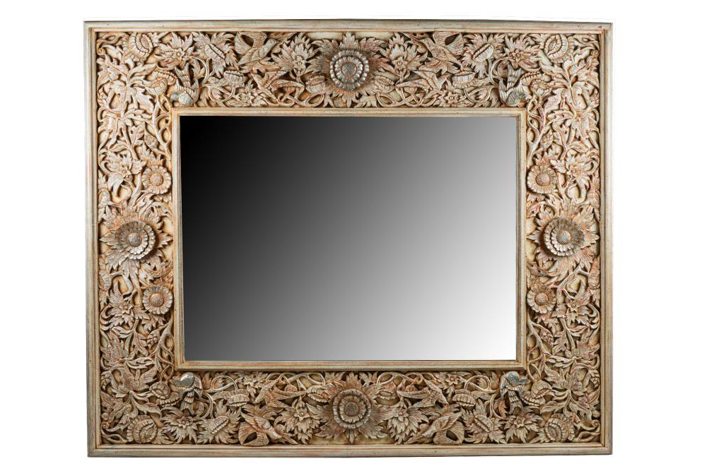 Appraisal: CONTEMPORARY CARVED PAINTED MIRRORthe foliate surround with silvered highlights to