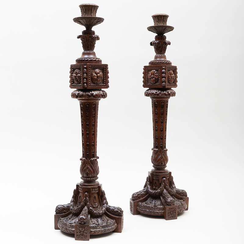 Appraisal: PAIR OF TALL CONTINENTAL CARVED MAHOGANY CANDLESTICKS POSSIBLY FRENCH x