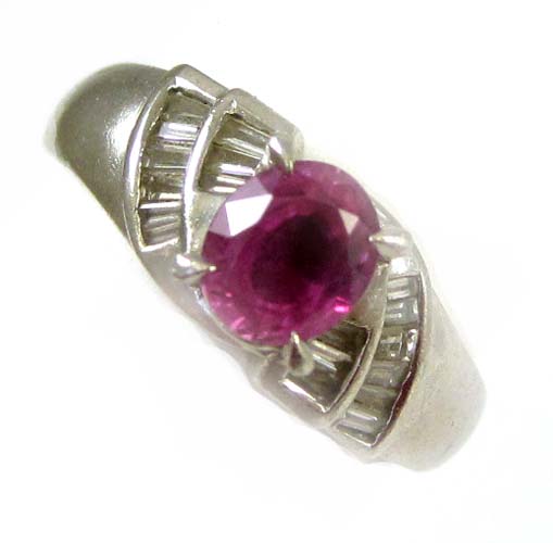 Appraisal: PINK SAPPHIRE DIAMOND AND PLATINUM RING centering an oval mixed-cut