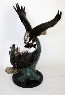 Appraisal: Bronze double soaring eagles sculpture Bronze double soaring eagles with