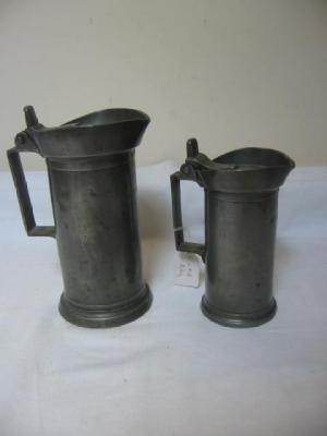 Appraisal: A FRENCH PEWTER LITRE MEASURE of cylindrical form with hinged