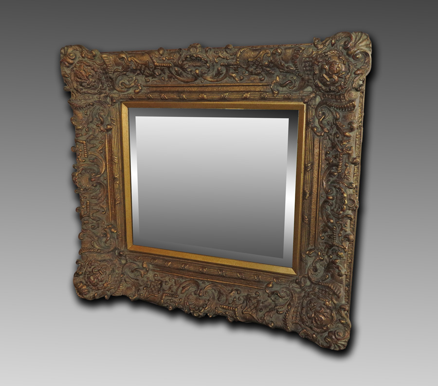 Appraisal: ORNATELY CARVED AND GILT WALL MIRROR Larger than most carved