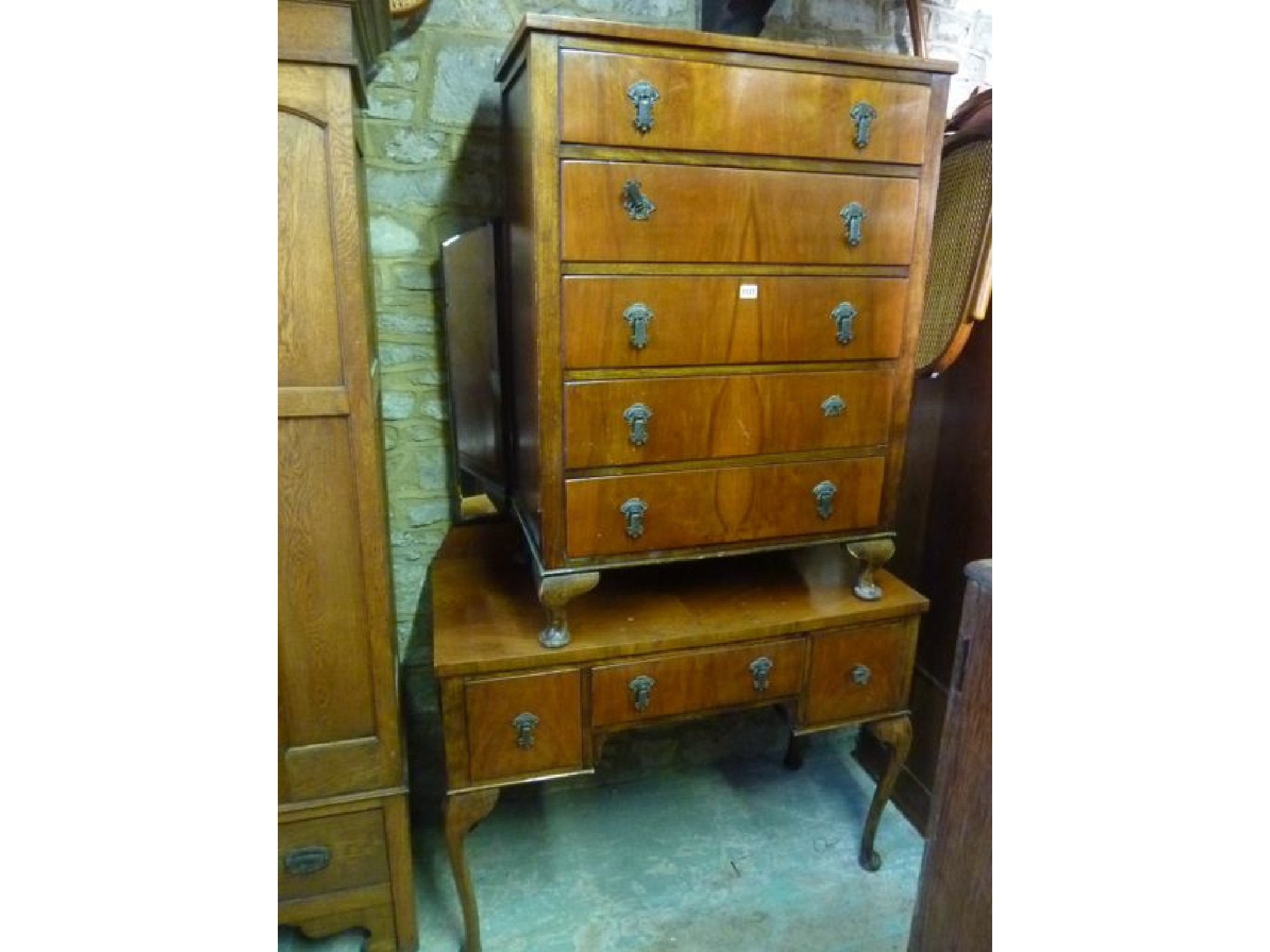 Appraisal: A s walnut veneered chest of five long drawers together