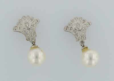 Appraisal: A Pair of Diamond and Pearl Earrings k white gold