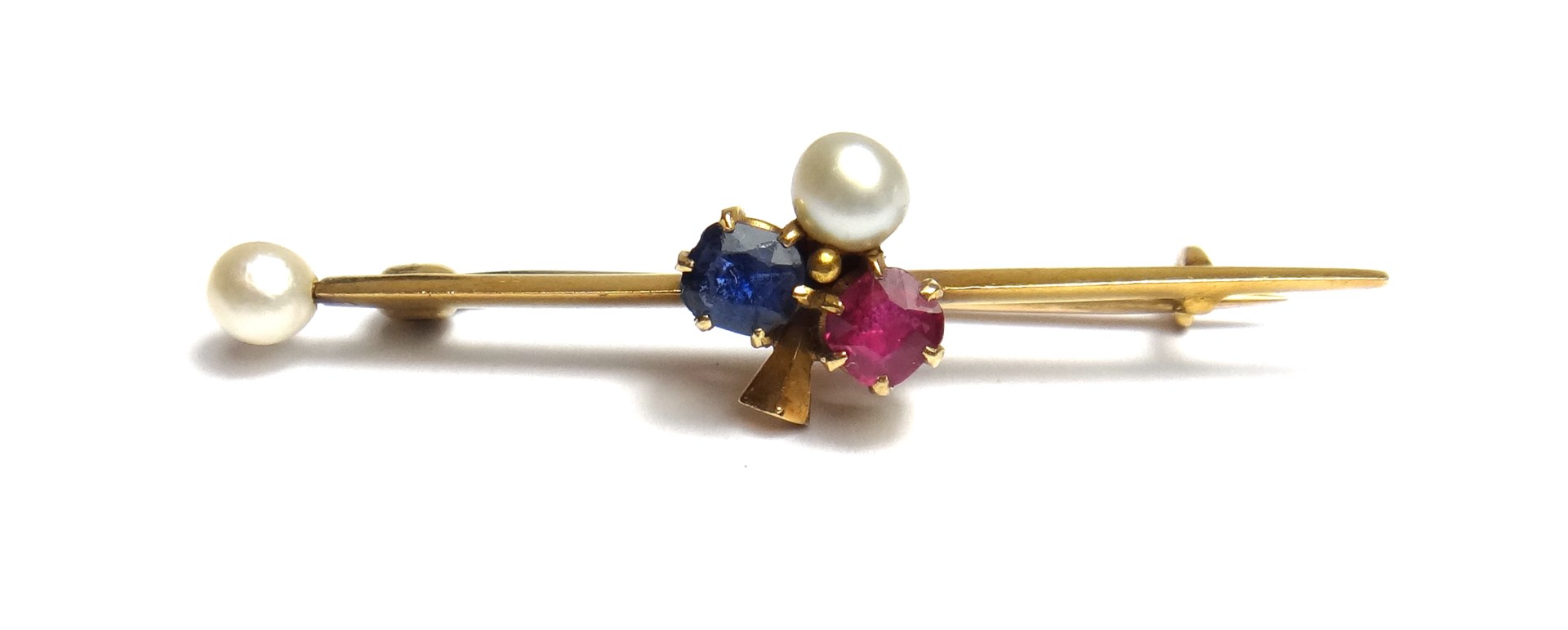 Appraisal: A gold ruby sapphire and cultured pearl set bar brooch