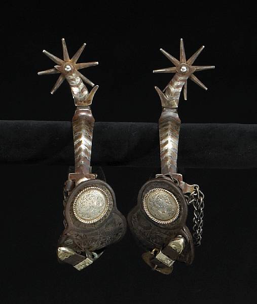 Appraisal: A pair of unmarked silver-mounted California style spurs Single mounted