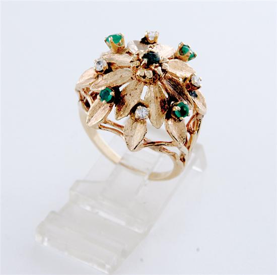 Appraisal: Diamond and emerald ring circa raised floral form petals centered