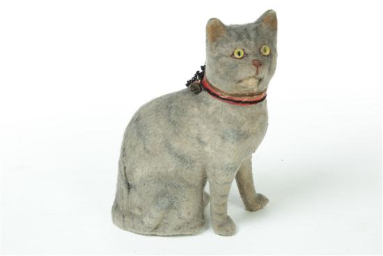 Appraisal: CAT PIPSQUEAK Late th-early th century Felt-covered seated cat with