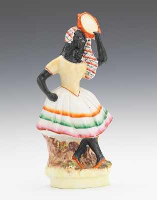 Appraisal: A Black Americana Figurine of a Dancing Girl Dancing figure