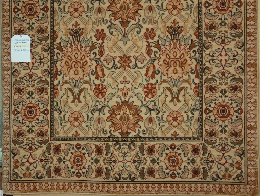 Appraisal: KARASTAN WOOL RUG having an allover pattern of large palmettes