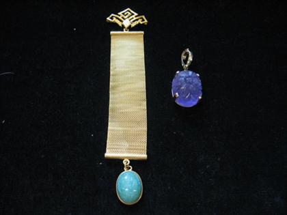 Appraisal: One amethyst pendant and one green jade-like stone brooch on