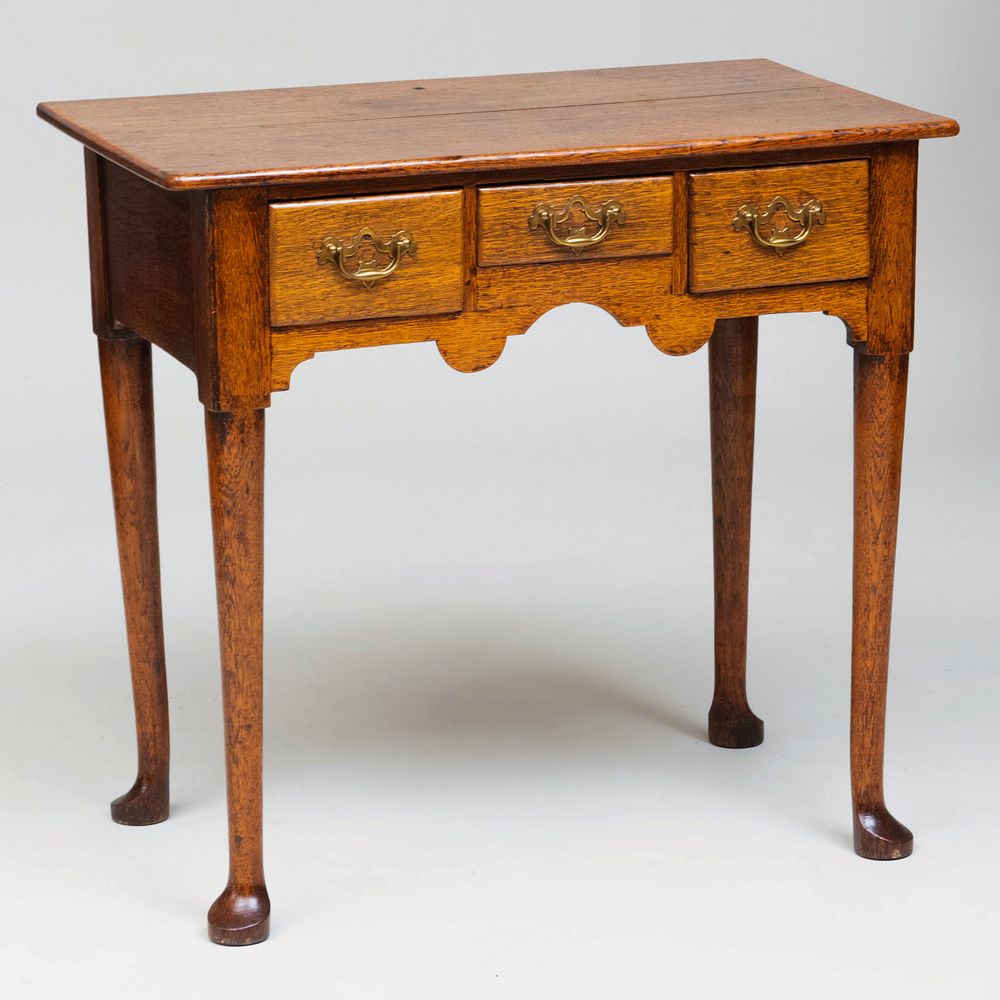 Appraisal: George II Carved Oak Side Table Fitted with three drawers