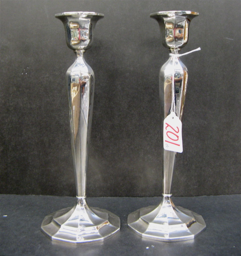 Appraisal: A PAIR OF STERLING SILVER CANDLESTICKS by International in a