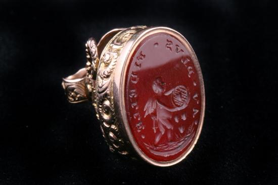 Appraisal: ENGLISH K YELLOW GOLD AND CARVED CARNELIAN OVAL SEAL Early