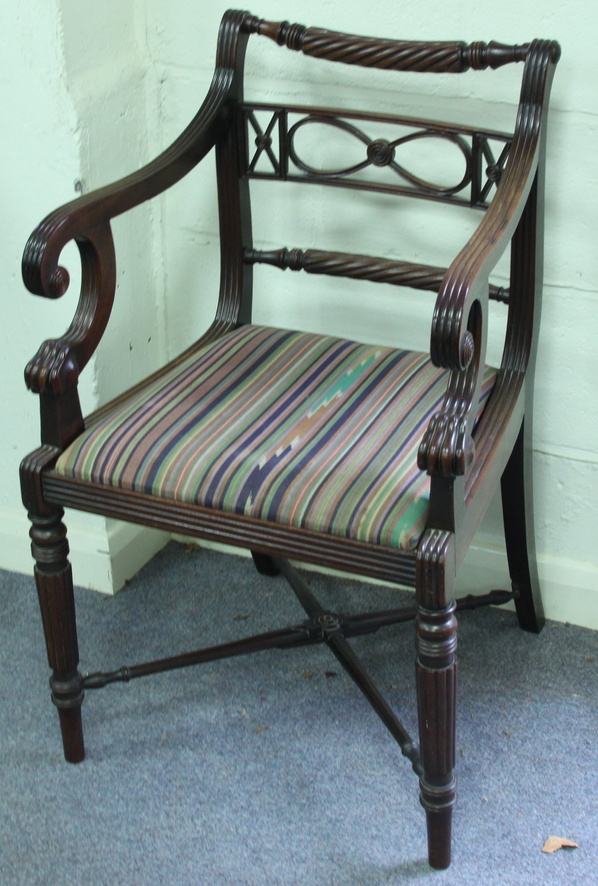 Appraisal: A Regency mahogany armchair with pierced horizontal and rope splat